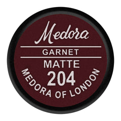 Lipstick shade cap label: Medora Garnet Matte 204