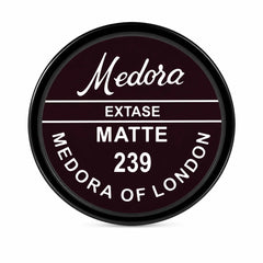 Medora Extase matte 239 tin, maroon round label with white and gold text