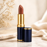 Matte lipstick in dark blue tube with gold cap, brown bullet visible