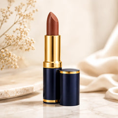 Matte lipstick in dark blue tube with gold cap, brown bullet visible