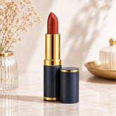 Medora 239 matte lipstick with exposed terracotta bullet in gold tube and navy base