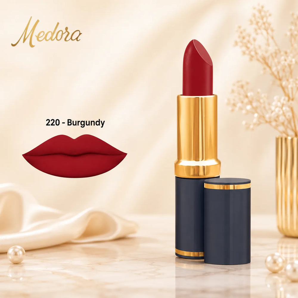 Burgundy matte lipstick with gold cap and black container, with burgundy lip swatch