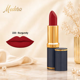 Burgundy matte lipstick with gold cap and black container, with burgundy lip swatch