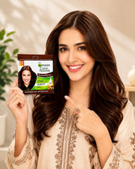 Brown 4.0 permanent hair color box held up in front of long wavy hair