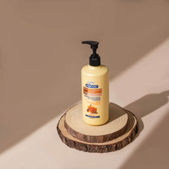 Biocos Age Reversal lotion bottle with black pump, pale yellow formula