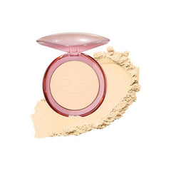 Pressed face powder compact with open lid and round light beige powder pan