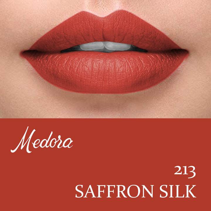 Red-orange lipstick on lips, showing smooth satin finish