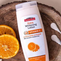 Vitamin C whitening lotion bottle with orange illustrations, white plastic, Saeed Ghani.