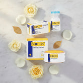 Skincare set with Biocos beauty cream jar, cream box, and energy whitening serum bottle.