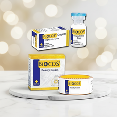Biocos beauty cream jar with cream box and energy whitening serum bottle with carton.