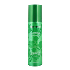Green hair serum bottle with silver cap and BREMOD label