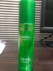 Green hair serum bottle with silver cap and BREMOD logo