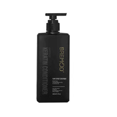 Keratin conditioner bottle front view with black pump and Bremod label