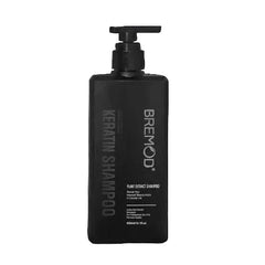 Keratin shampoo bottle with pump dispenser, dark label with Bremod text