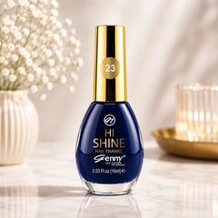 Blue nail enamel bottle, gold cap with 23 label and glossy rounded glass.