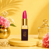 Magenta lipstick with gold cap and dark Beauty Frost case