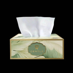 Gentle tissue box with leaf print and tissue sheets coming out