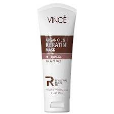 Argan oil and keratin hair mask, white squeeze tube with brown label panel.