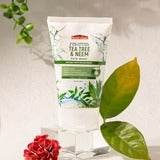 Tea tree & neem face wash tube, white with green label and leaf graphics, 100 ml.