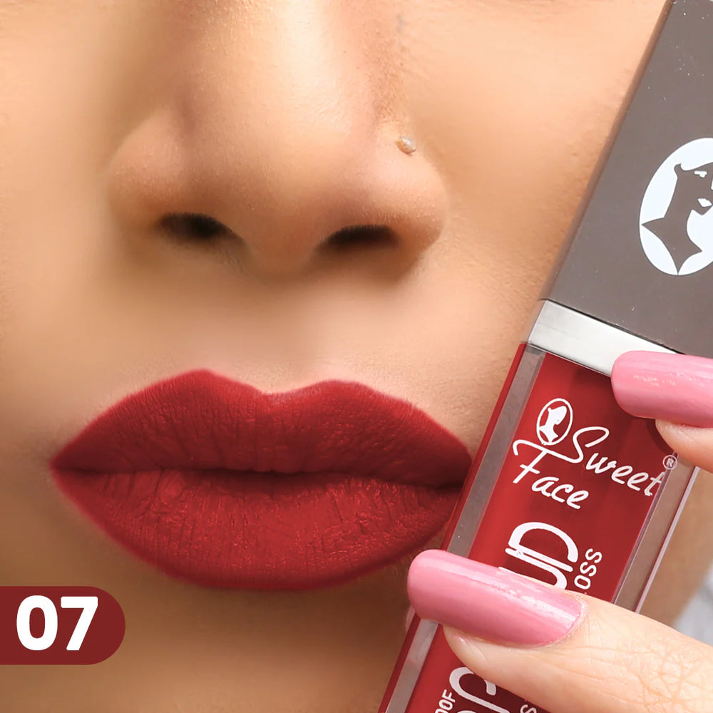 Lip gloss tube and wand applying deep red lip color, shade 07