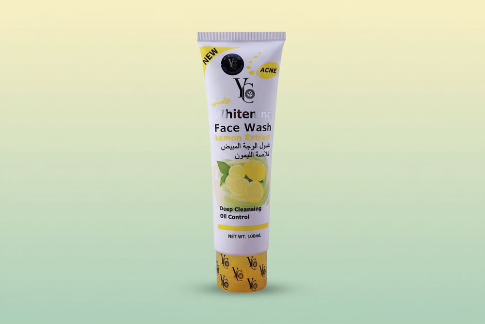 Whitening face wash tube with lemon extract, 100ml, purple with yellow accents.