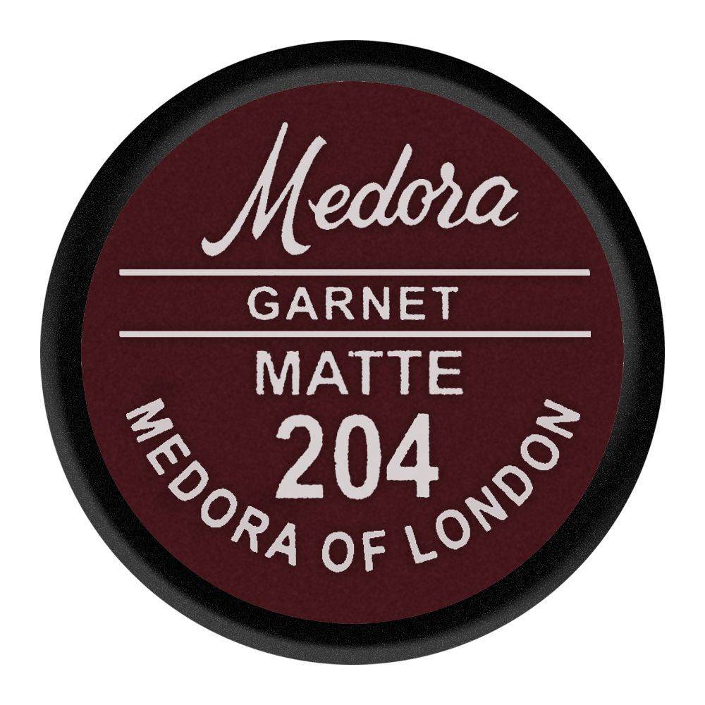Lipstick shade cap label: Medora Garnet Matte 204