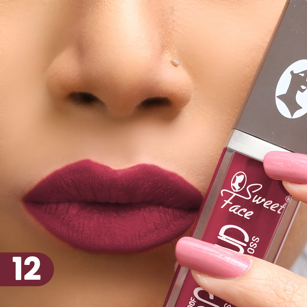 Lip gloss on lips with rose-pink applicator, deep berry mauve finish