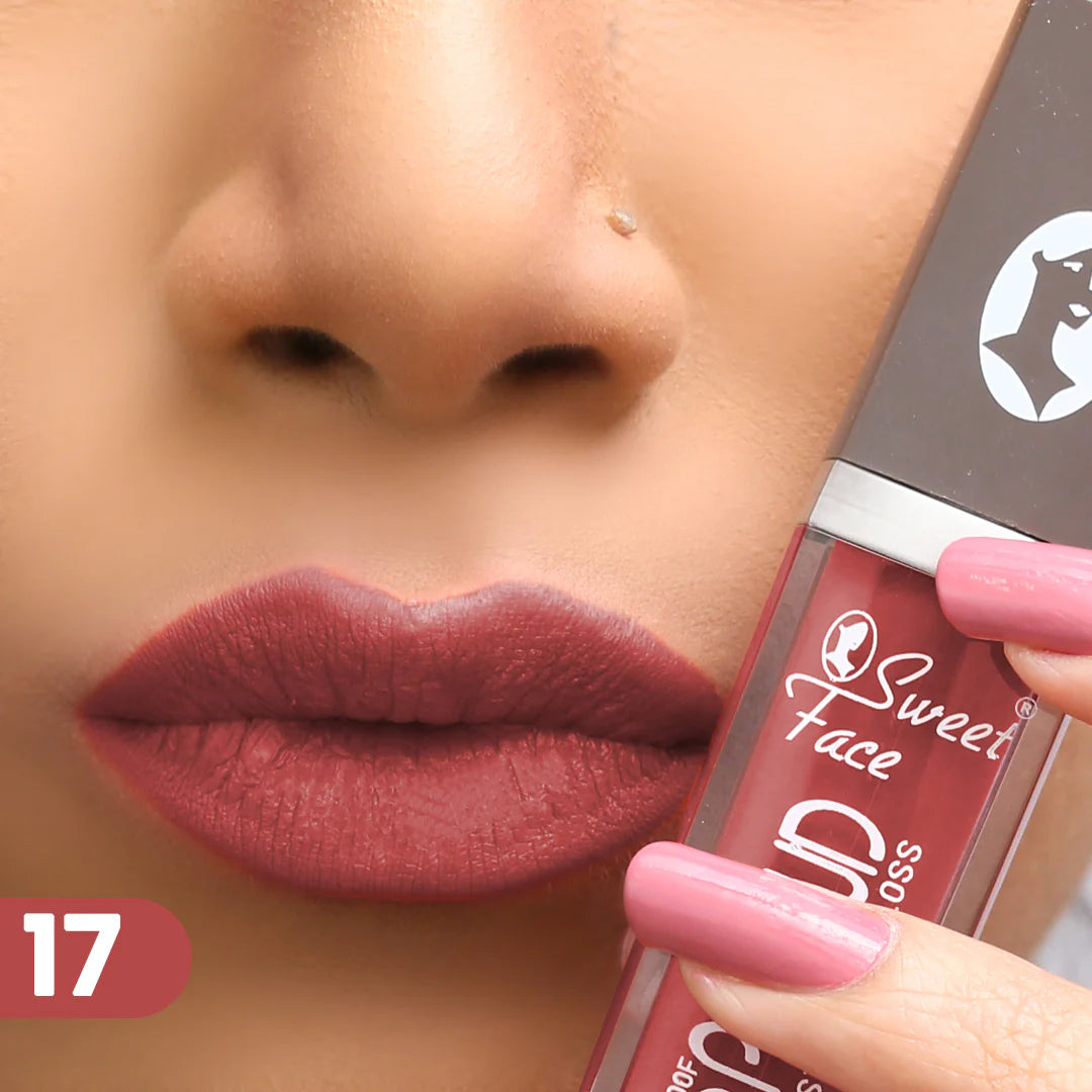 Lip gloss on lips with rose-pink applicator, deep plum rose-brown finish
