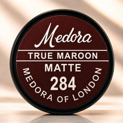 Matte lipstick cap labeled True Maroon 284
