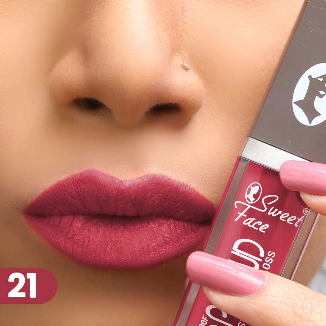 Lip gloss on lips with rose-pink applicator, bright berry red finish