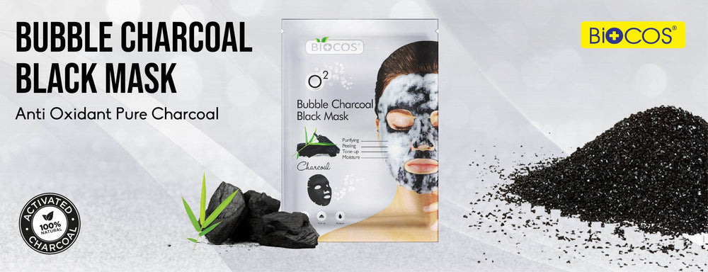 Biocos bubble charcoal black face mask box with activated charcoal pile