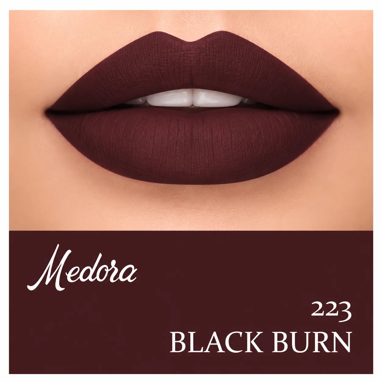 Close-up of dark berry lips with lipstick swatch
