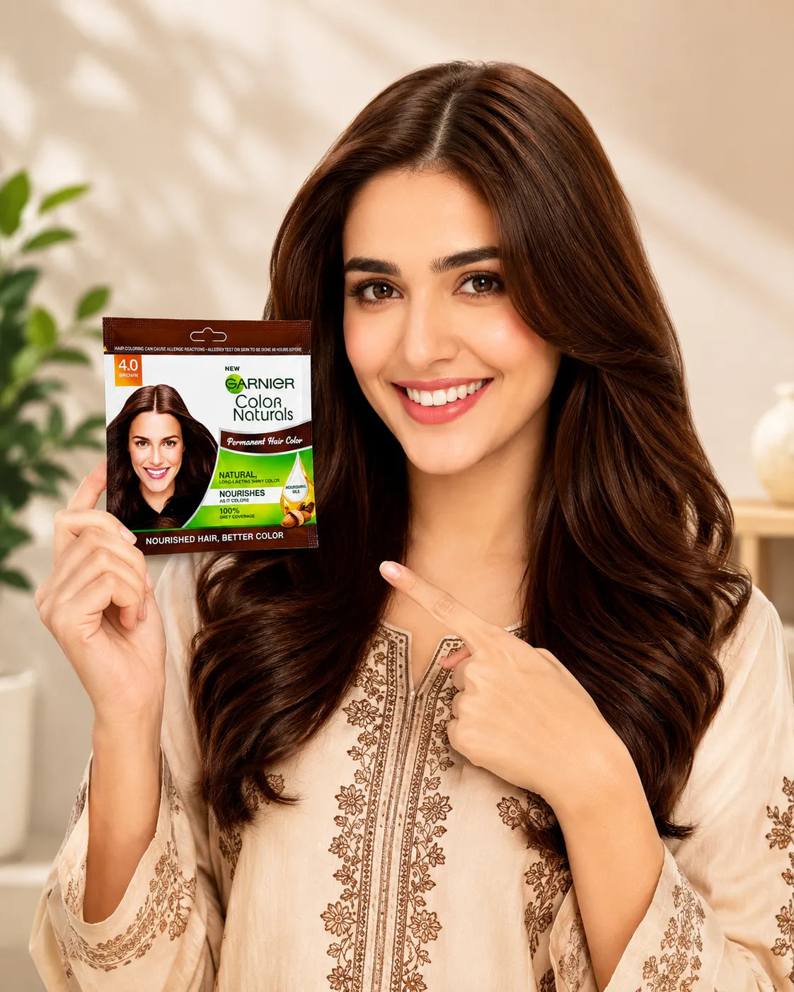 Brown 4.0 permanent hair color box held up in front of long wavy hair