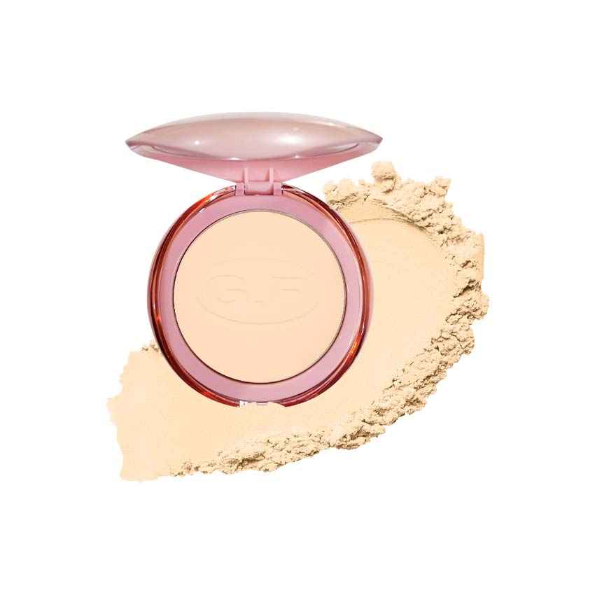 Pressed face powder compact with open lid and round light beige powder pan