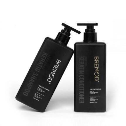 Keratin conditioner and shampoo bottles with black pumps, Bremod labels visible