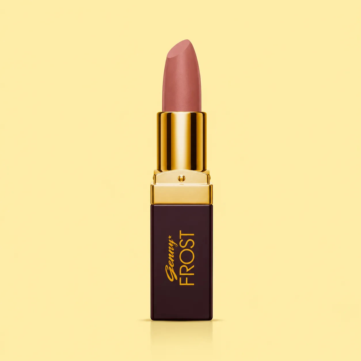 Close-up of mauve-rose lipstick with gold cap and dark square tube