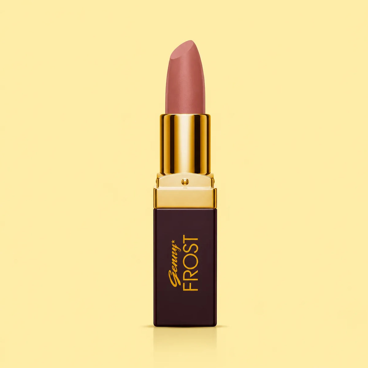 Close-up of mauve-rose lipstick with gold cap and dark square tube
