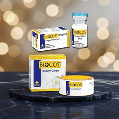 Biocos beauty cream jar and cream box with energy whitening serum bottle and carton.