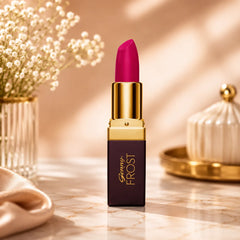Genny Frost lipstick in magenta shade, gold cap with bullet tip