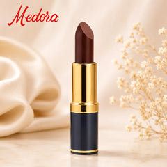 Dark berry lipstick in gold tube with cap open, on light background