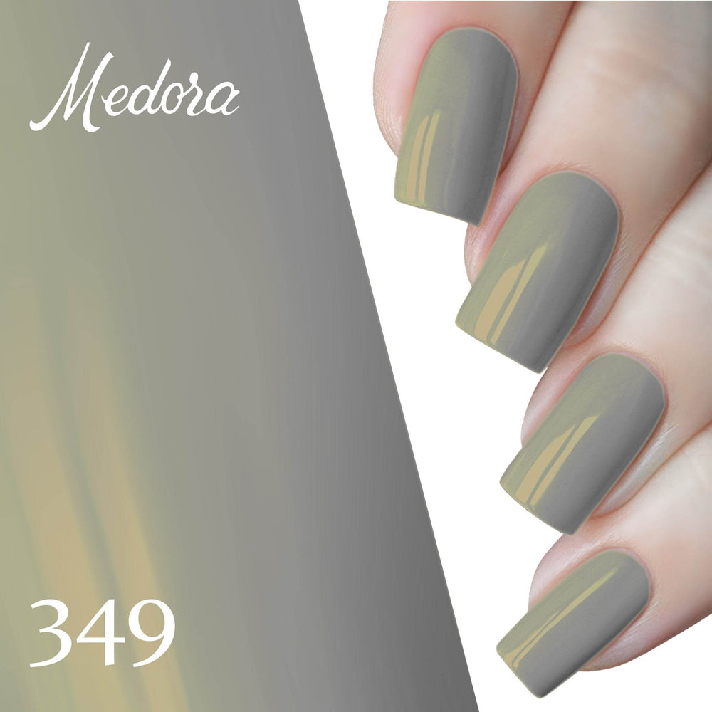 Hands with dark gray nail polish, thin golden lines accenting each nail