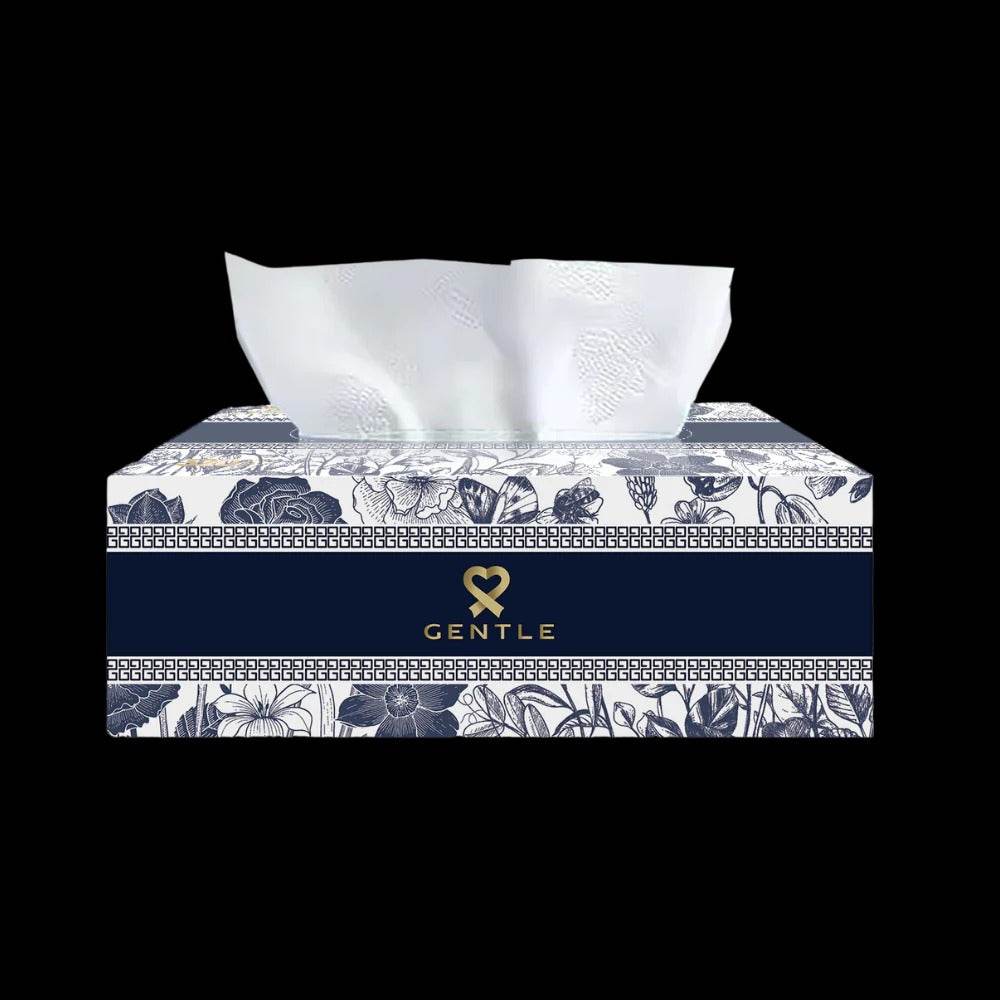 Blue floral tissue box with tissues pulled up from the dispenser