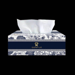 Floral tissue box with white tissues emerging, blue and white patterned front