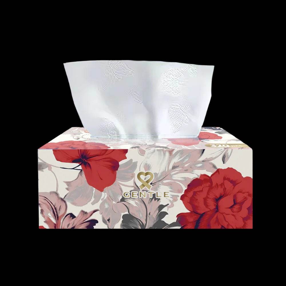 White 4-ply tissues pulled from floral tissue box with Gentle logo on front