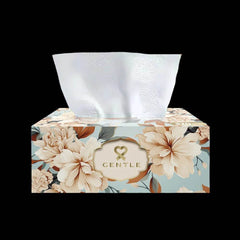 Floral tissue box with white tissues protruding; Gentle logo on beige cover