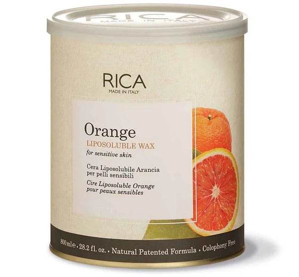 Orange liposoluble wax tub with clear lid and front label, orange slice graphic