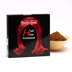 Hair henna powder box with red Saeed Ghani artwork and separate bowl of brown powder