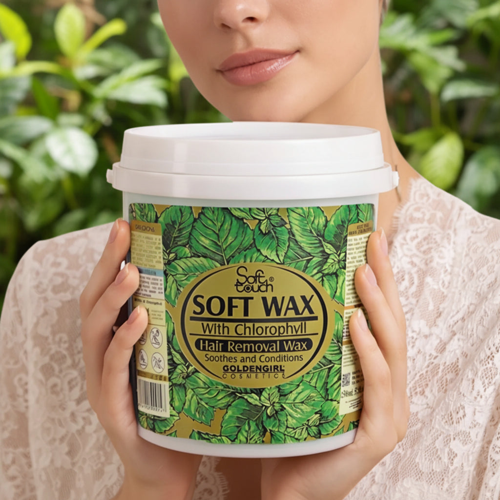Hair removal wax tub with chlorophyll held in hands, white lid and green leaf label
